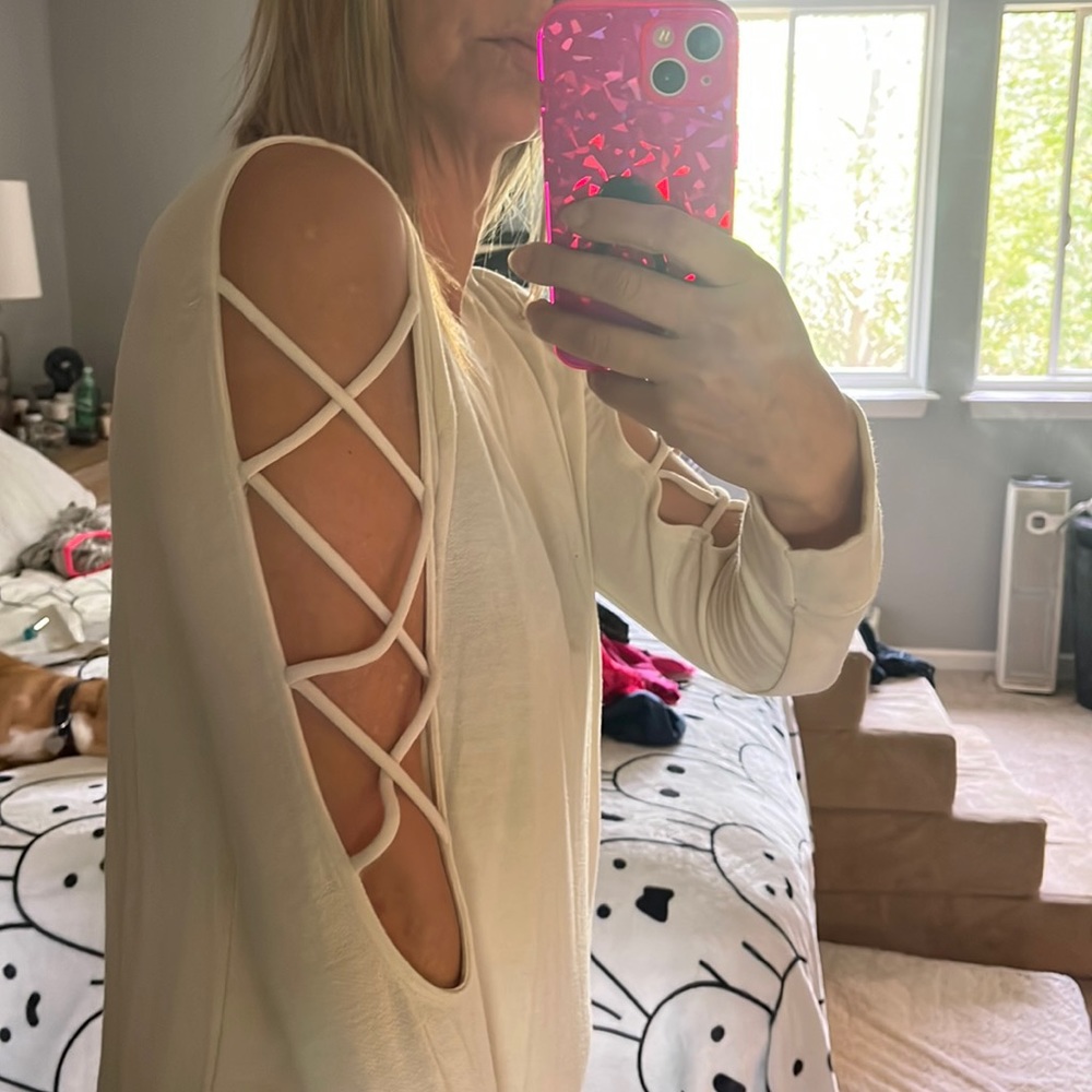 Cream New light weight sweater with arm detail.